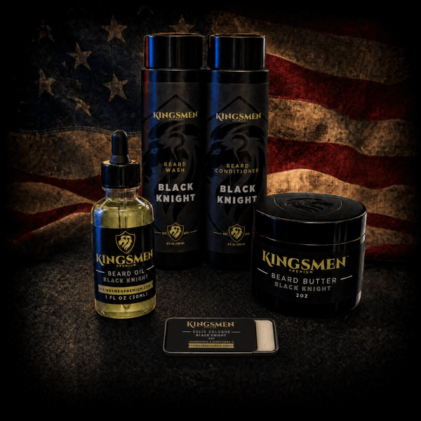 Kingsmen beard care set including Black Knight Beard Wash, Black Knight Beard Conditioner, Black Knight Beard Oil, and Black Knight Beard Butter, arranged against a dark American flag background.