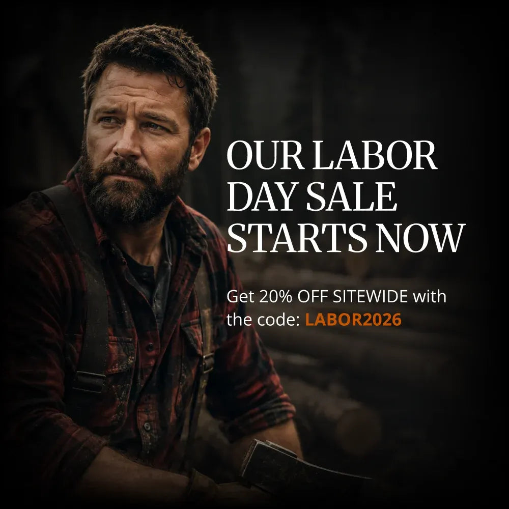 Promotional advertisement featuring a bearded man in a red plaid shirt and suspenders holding an axe, with large white text reading 'OUR LABOR DAY SALE STARTS NOW' and smaller text offering 20% off sitewide with code LABOR2026.